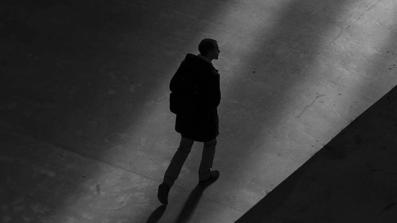 Close up on a plate of mashed potatoes, topped with baked pork chops with cream of mushroom soup, and a side of green beans.